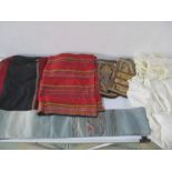 A Japanese sash with metal thread, two babies christening gowns, two Laos tribal textiles, a pair of