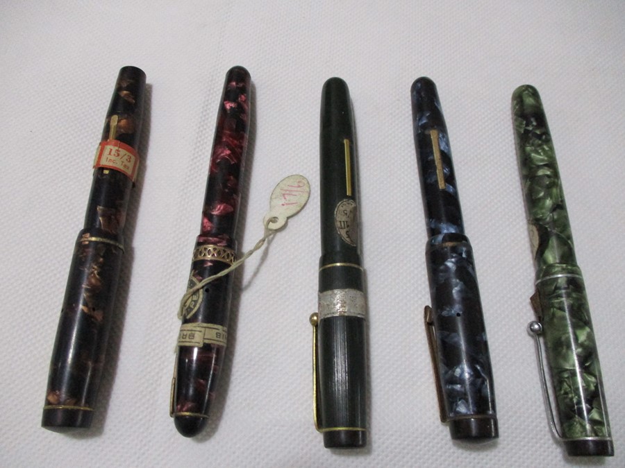 A collection of five fountain pens. Includes one Mentmore Autoflow, two Summit and two Eversharp.