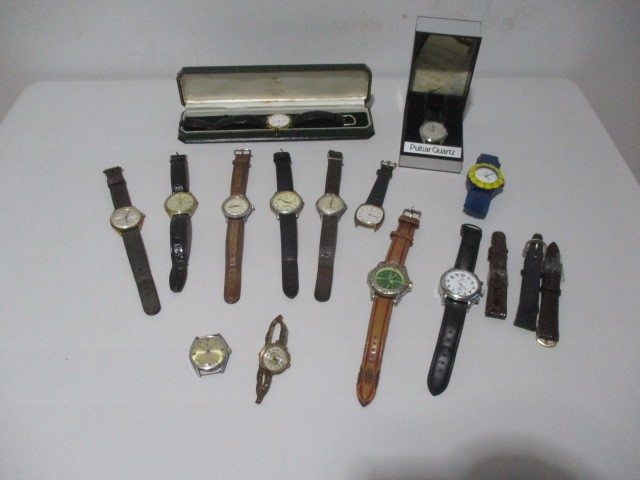 A collection of various watches including Avia Olympic, Lorus, Timberland, Roamer, Timex, Pulsar