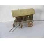 A vintage papermaché gypsy wagon