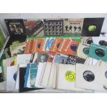 A collection of approx. 100 7" vinyl single records including twenty one Beatles related singles,