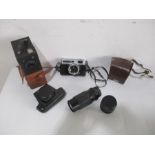 A collection of cameras including a Six 20 Popular Brownie, a Ross Ensign Ful- Vue super, a