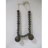 A quantity of African tribal bronze balls - largest balls approx. 8.5cm in width