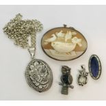 A silver mounted cameo, silver locket on chain, enamelled silver brooch and two 925 silver owls