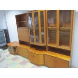 A G-Plan mid-century sectional wall unit comprising display cabinets, drinks cabinet etc