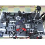 A collection of cameras and photographic equipment including Halina, Zenit B (x2) Zenit E, Zenit EM,