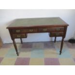 An Edwardian ladies writing desk with leather top