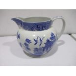 An oversized willow pattern Spode Jug