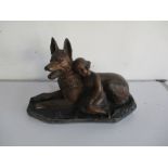 A plaster model of a dog and child