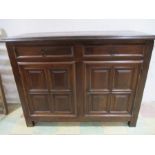 A French walnut 17th Century cupboard with two drawers over twin panelled doors