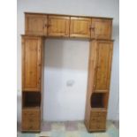 A pine overbed cupboard unit