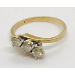 An 18ct gold diamond 3 stone ring. Size J