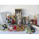 A collection of various boxed porcelain dolls