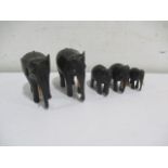 A collection of five ebony elephants