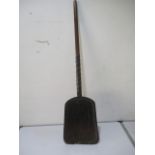A peat shovel with an antique repair