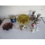 A collection of glassware and china including a marbled glass tankard with elephant handle,