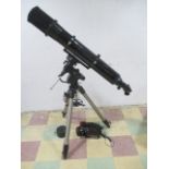 A Celestron C6-R 6" Refractor telescope on matching tripod and instruction manual, along with a