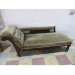 A Victorian chaise lounge with button back detailing