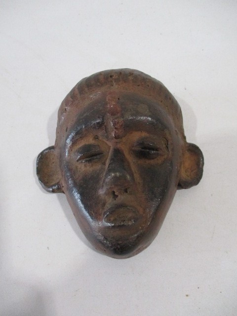 A small African clay mask - height 13cm