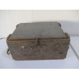A wooden ammo box with rope handles
