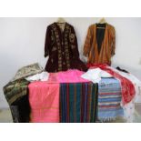 An assortment of interesting clothing and materials including a Goblys tapestry, Sari material,