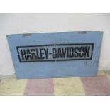 A reproduction Harley Davidson metal sign