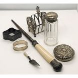 A hallmarked silver bookmark in the form of a trowel, silver lidded sugar caster, silver lid along