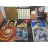 A collection of 12" vinyl records including Elvis Presley box sets, Stevie Wonder, ABBA, Michael