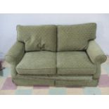 A modern green sofa bed