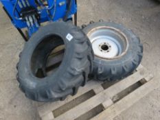 2 X SKIPLOADER TYRES PLUS A RIM