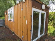 20FT STORAGE CONTAINER CONVERTED INTO ACCOMODATION WITH WINDOWS ON 3 SIDES AND PATIO DOORS IN ONE