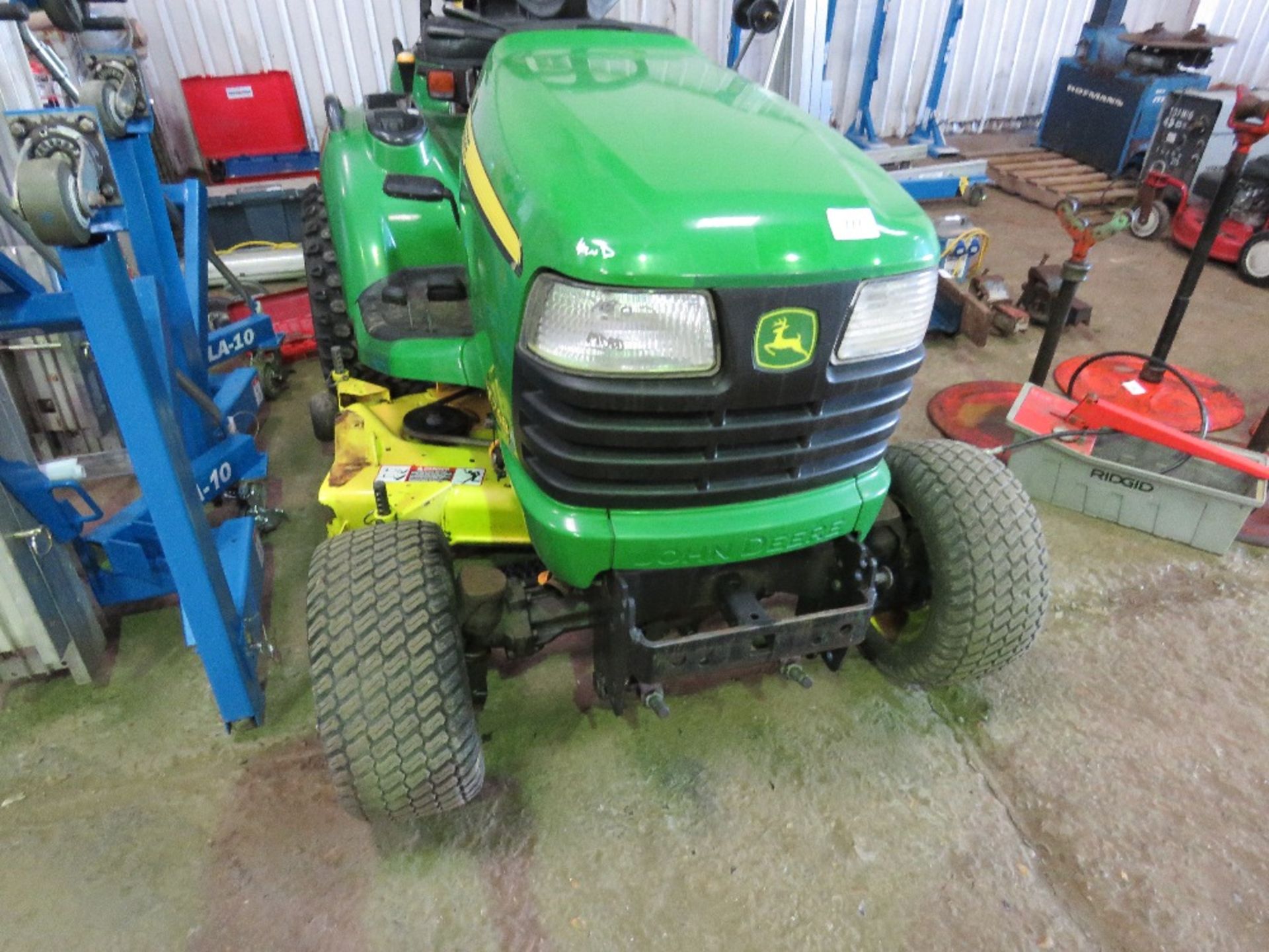 JOHN DEERE X748 4WD RIDE ON MOWER. WHEN TESTED WAS SEEN TO RUN, DRIVE, STEER AND MOWERS TURNED.
