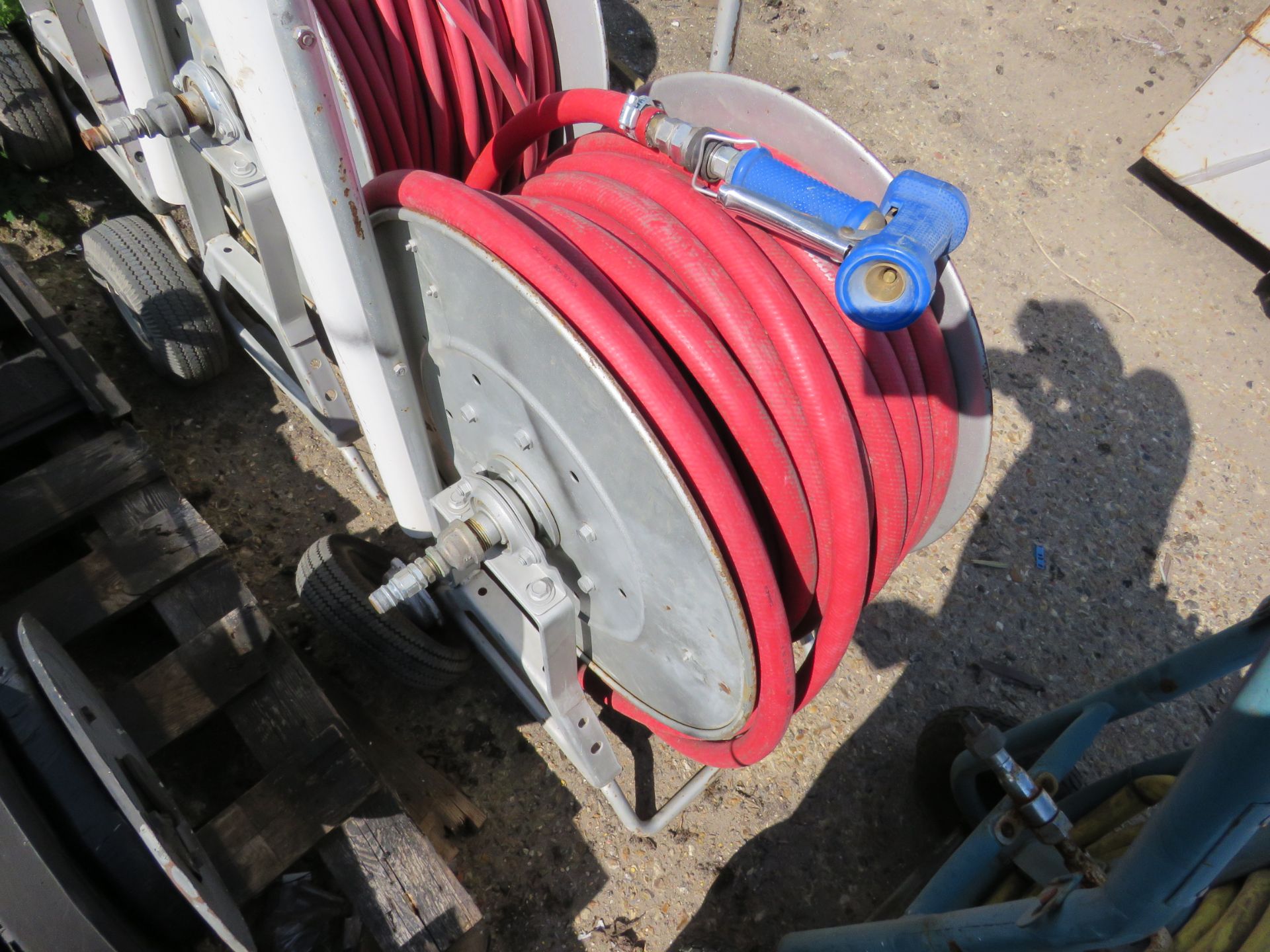 HOSE REEL ON TROLLEY.