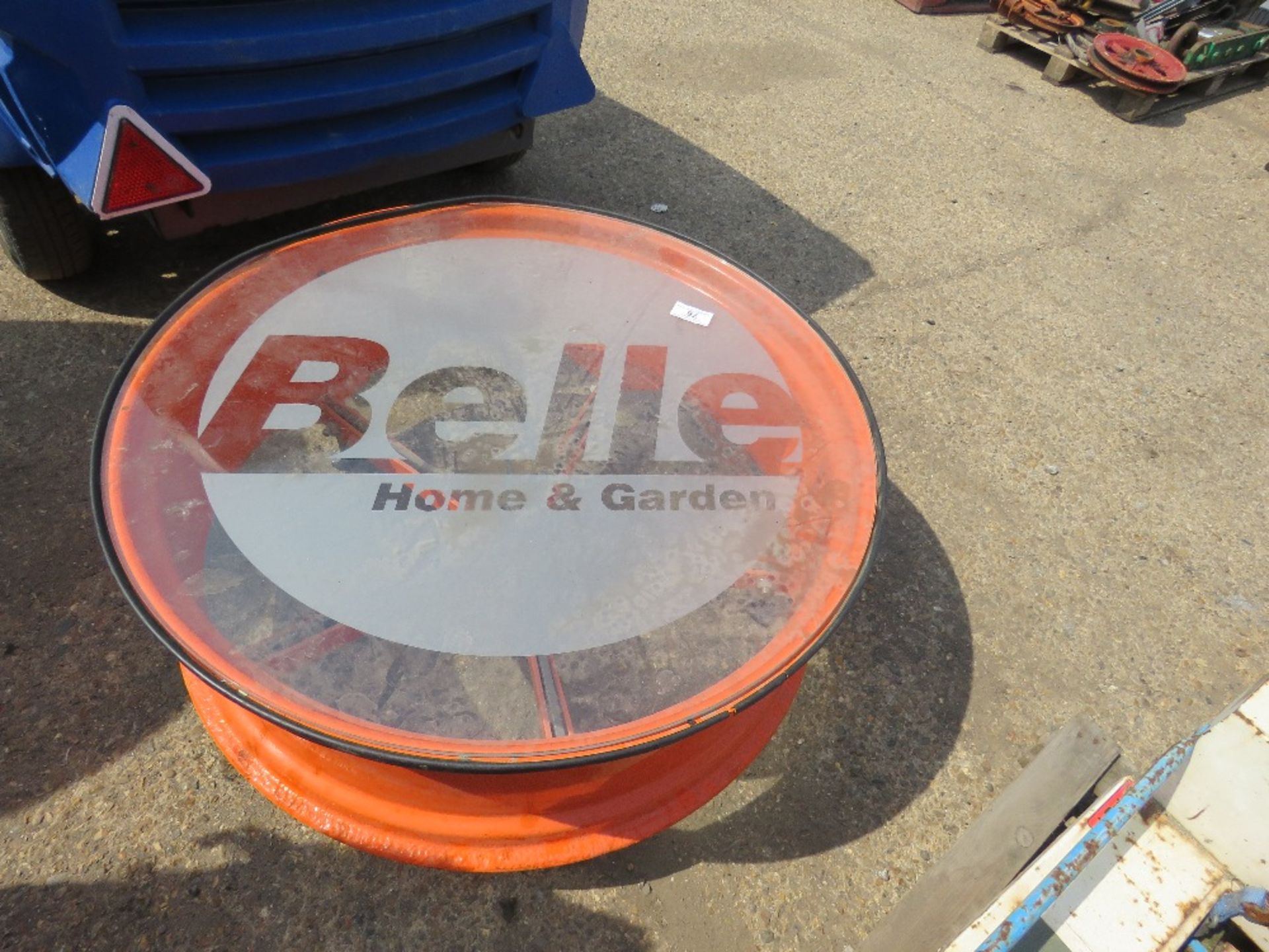 BELLE GLASS TOPPED COFFEE TABLE MADE FROM TRACTOR WHEEL RIM. - Image 2 of 2