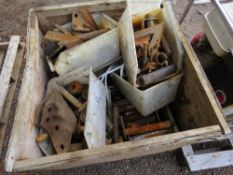 WOODEN STILLAGE CONTAINING ASSORTED BUCKET PINS AND TEETH.