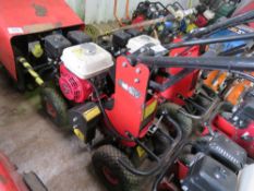 TRACMASTER PETROL ENGINED TURF CUTTER. WHEN TESTED WAS SEEN TO RUN, DRIVE AND BLADE MOVED. DIRECT FR
