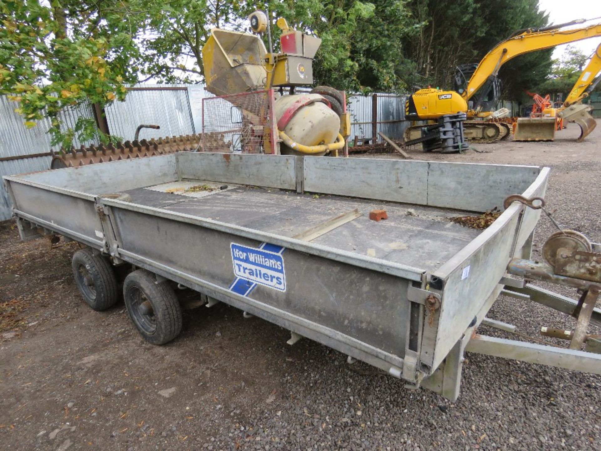 IFOR WILLIAMS TWIN AXLED 14FT PLANT TRAILER WITH DROP SIDES and a set of loading ramps.