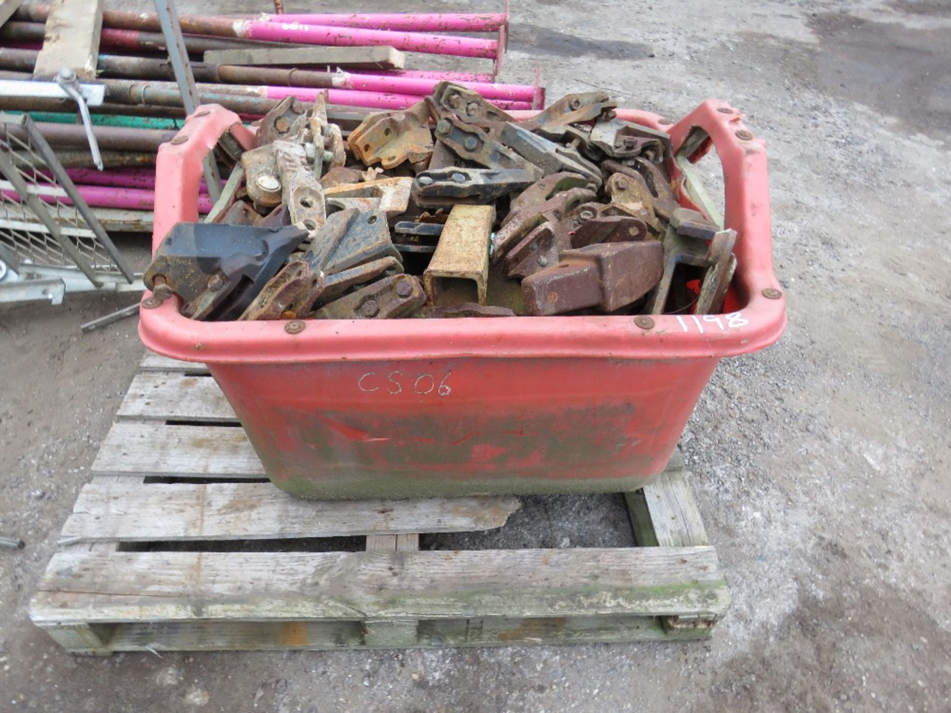 LARGE BIN OF EXCAVATOR BUCKET TEETH.