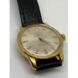 18 carat yellow gold Longines Conquest. Automatic. Centre second hand with date at 12 o’clock.