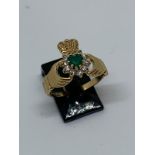 9 carat yellow gold emerald and CZ claddagh ring