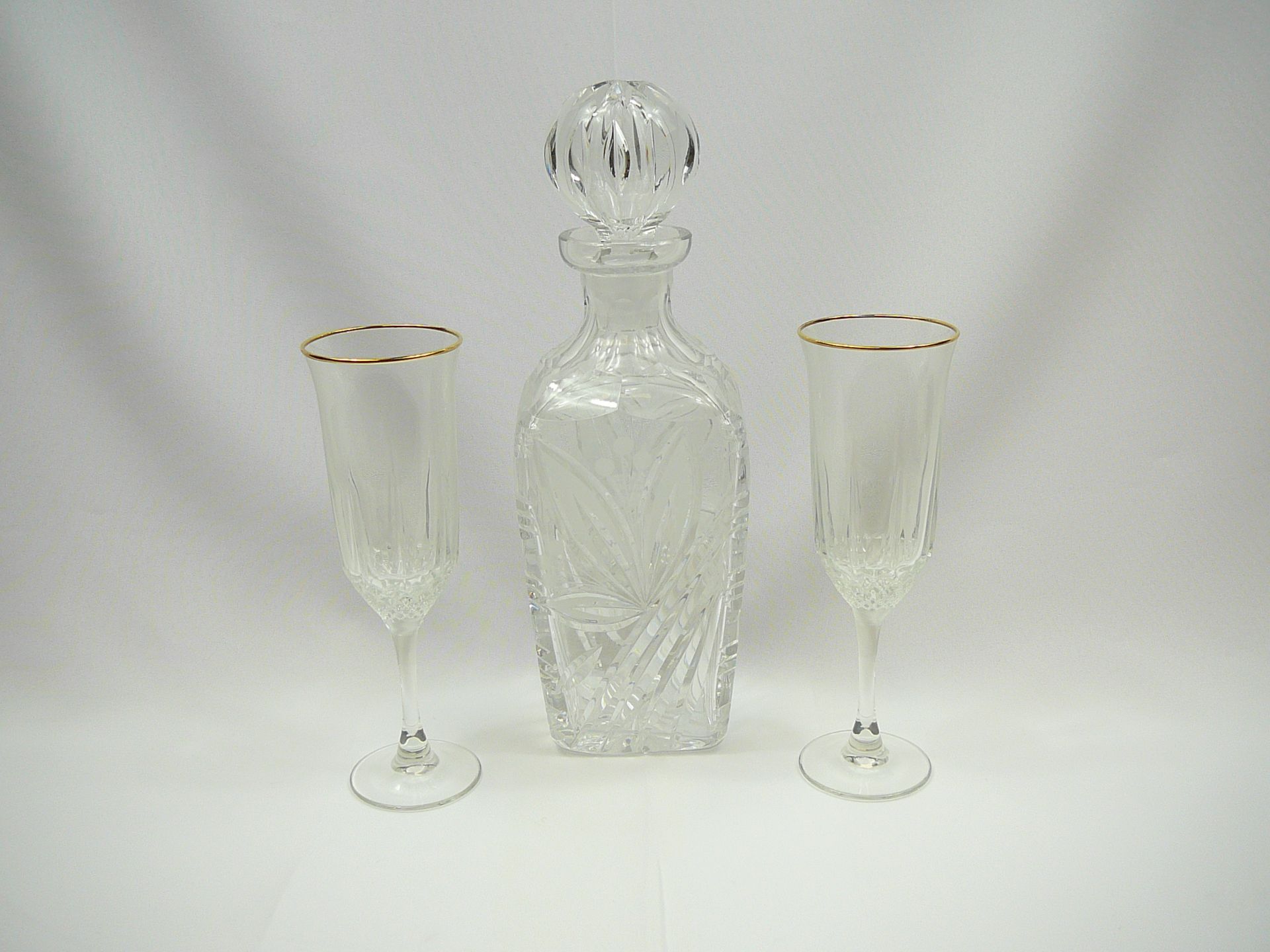 Crystal decanter and pair of champagne flutes