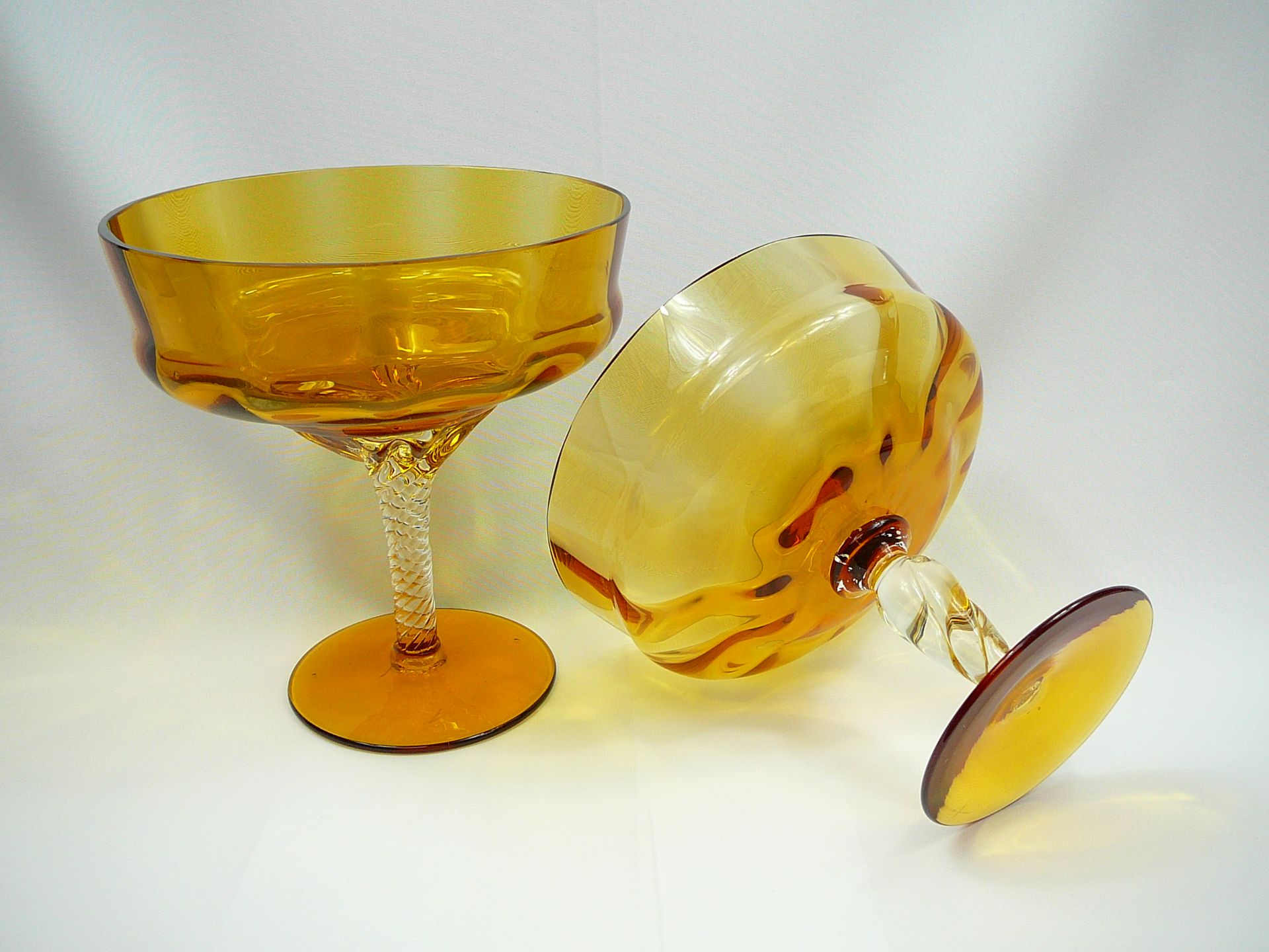 Pair of amber glass graduated tazzas