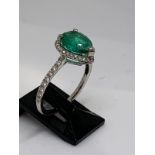 Platinum emerald and diamond ring