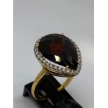 18ct gold diamond and garnet ring