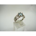Silver blue topaz and diamond ring