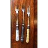 Assorted antique condiment and serving cutlery