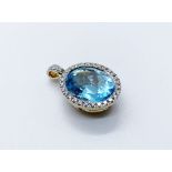 9ct gold blue topaz & diamond pendant