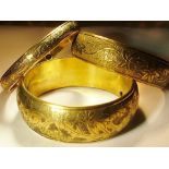 Set of three graduated brass bangles