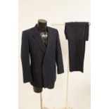 A vintage gentleman's Christian Dior pinstriped double breasted suit. Size 40 S.