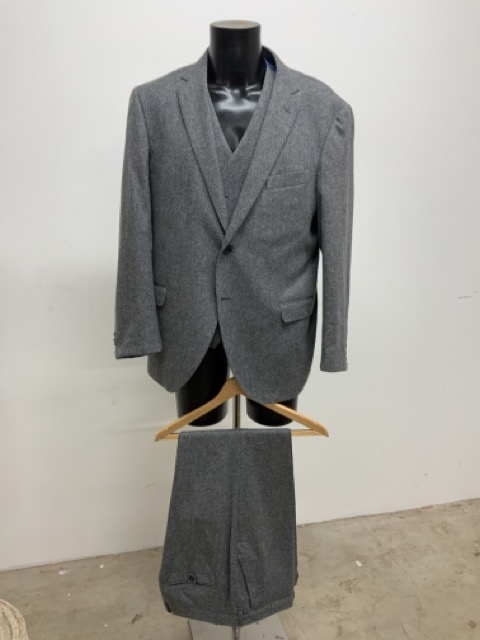 A vintage three piece wool flannel suit by Hackett. Size 46.
